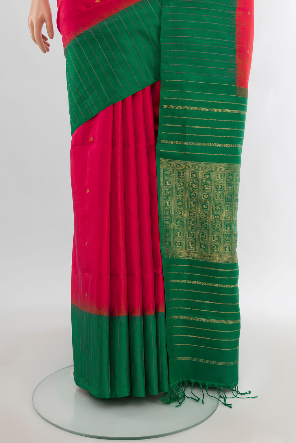 Pleats and pallu of Pink Soft Silk Saree with Zari Butta on the body and Checks Border. 