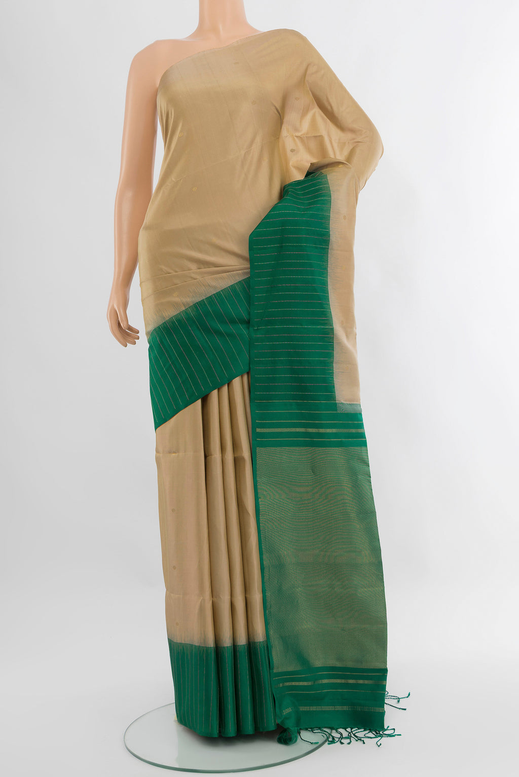 Dark Beige Soft Silk Saree with Zari Butta on the body and Fancy Border.  displayed on a mannequin