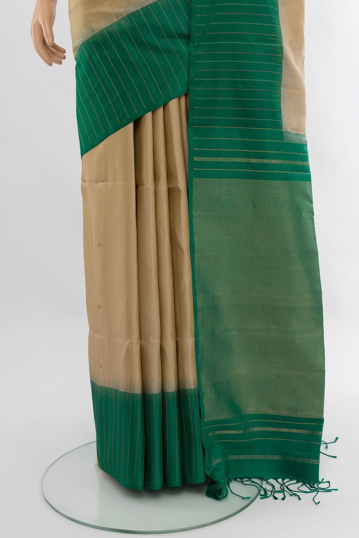 Pleats and pallu of Dark Beige Soft Silk Saree with Zari Butta on the body and Fancy Border. 
