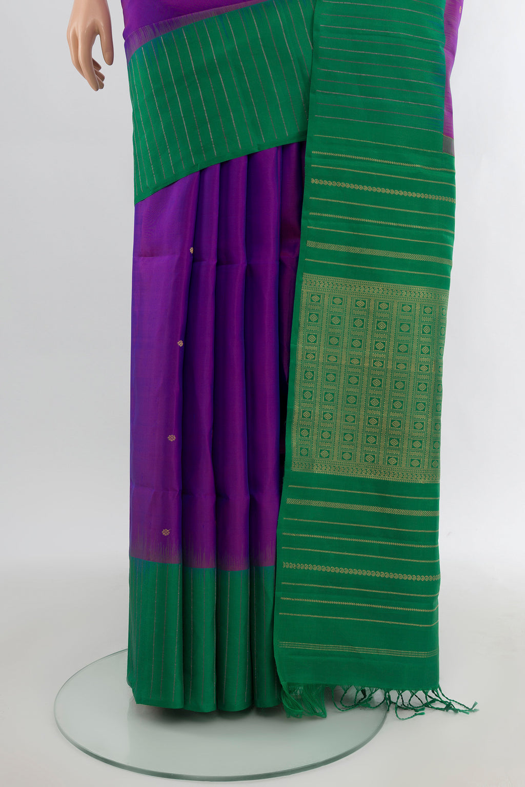 Pleats and pallu of Purple Soft Silk Saree with Zari Butta on the body and One Side Border. 