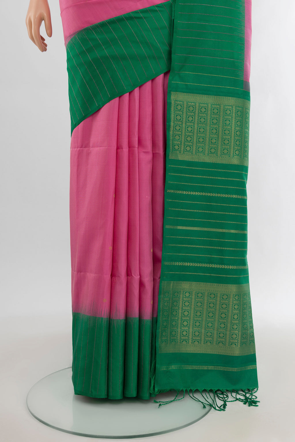 Pleats and pallu of Rose pink Soft Silk Saree with Zari Butta on the body and One Side Border. 
