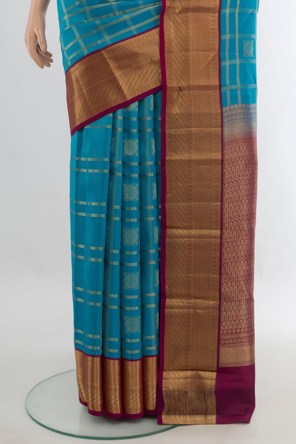 Pleats and pallu of Pure Silk Light Blue Kanchipuram Saree with Checked design on the body and Zari Border. 