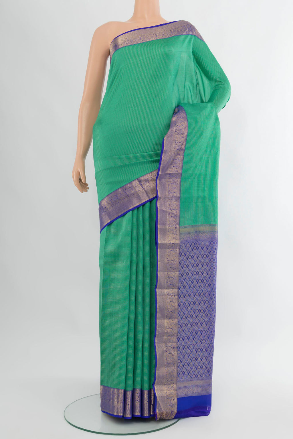 Sea Green Kanchipuram Silk Saree with Stripes on the body and Zari Border.  displayed on a mannequin