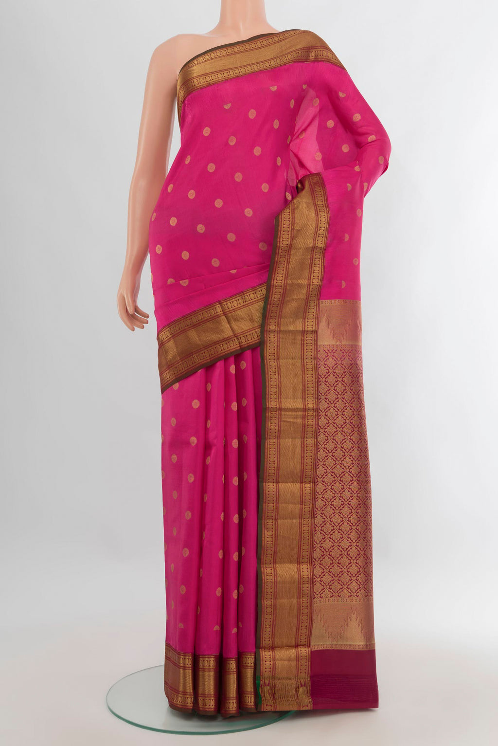 Pure Silk Dark Pink Kanchipuram Saree with Zari Butta on the body and Zari Border.  displayed on a mannequin