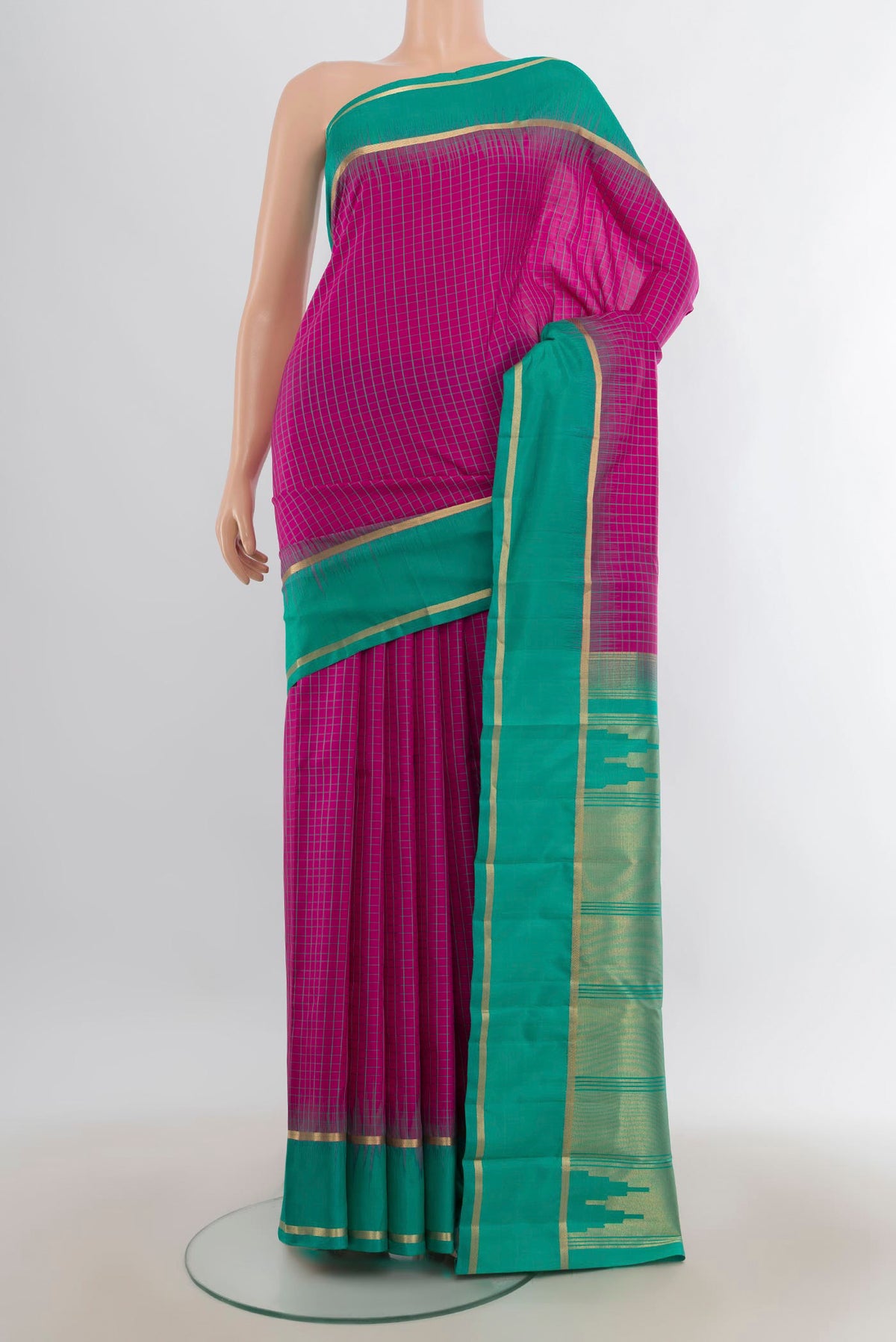 Pure Silk Pink Kanchipuram Saree with Checked design on the body and Plain Border.  displayed on a mannequin