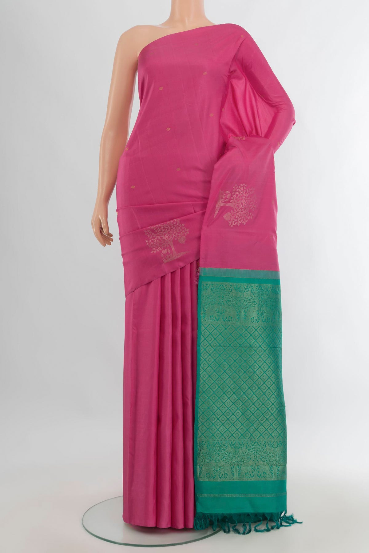 Pure Silk Pink Soft Saree with Zari Butta on the body and Without Border.  displayed on a mannequin