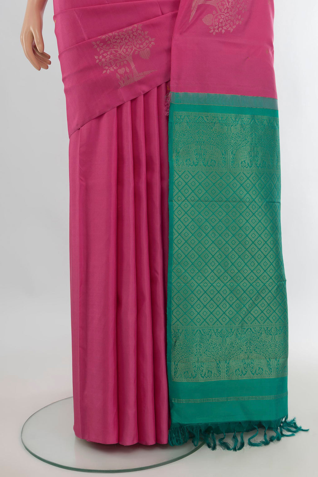 Pleats and pallu of Pure Silk Pink Soft Saree with Zari Butta on the body and Without Border. 