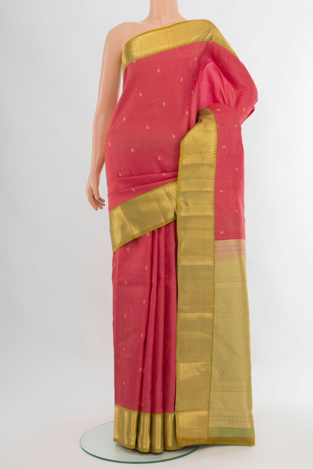 Coral Kanjivaram Silk Saree with Zari Butta on the body and Zari Border.  displayed on a mannequin