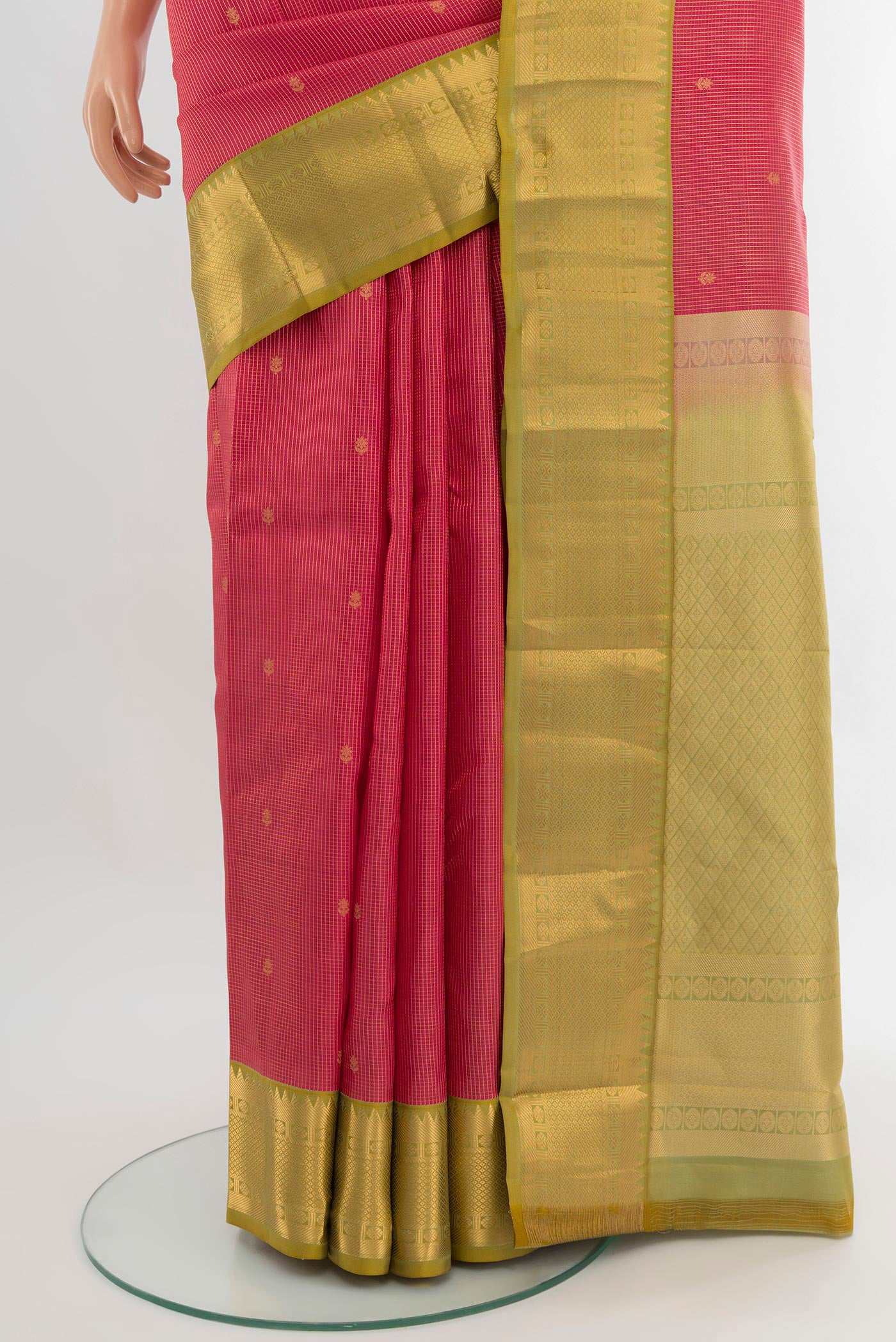 Pleats and pallu of Coral Kanjivaram Silk Saree with Zari Butta on the body and Zari Border. 
