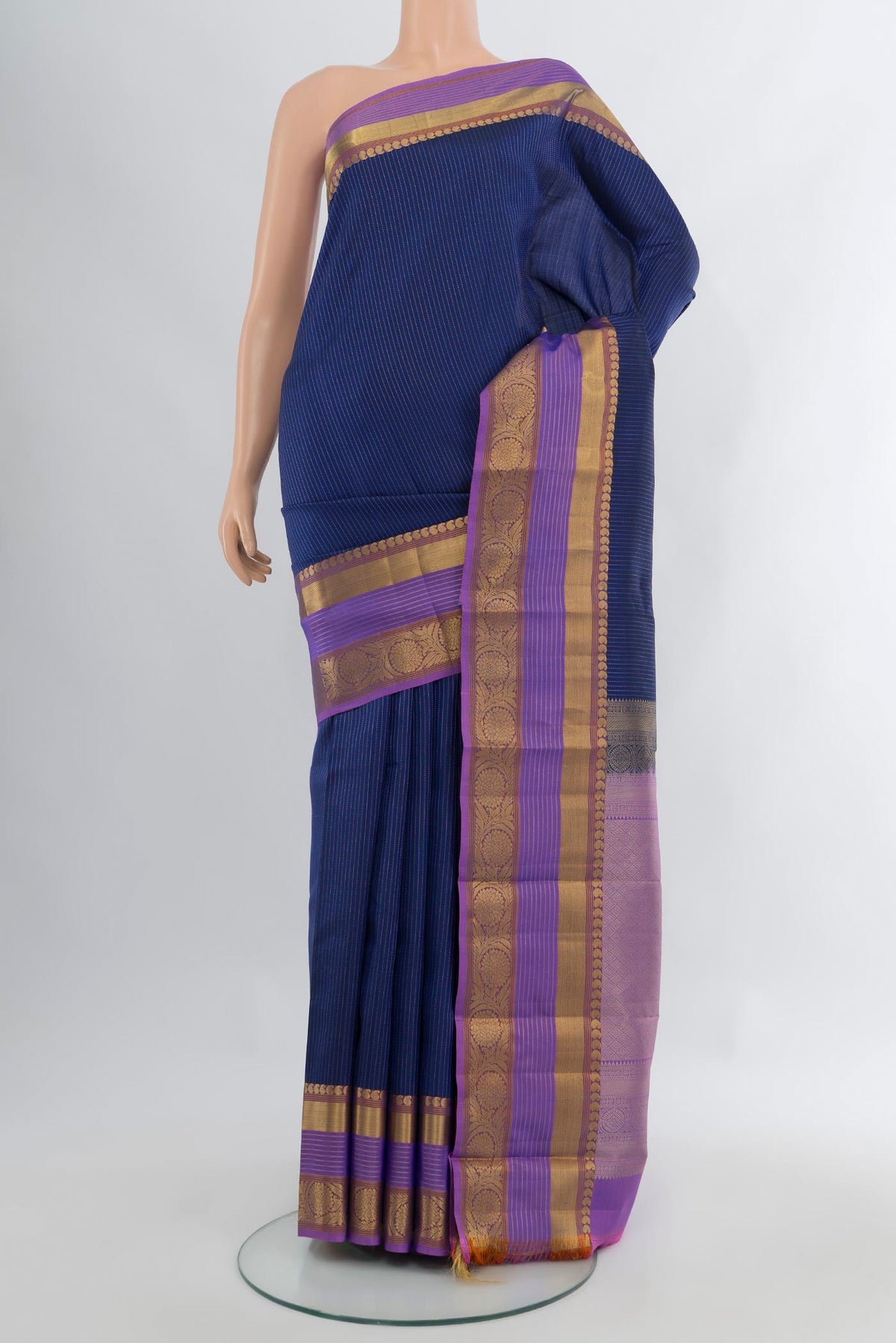 Dark Blue Kanjivaram Silk Saree with Stripes on the body and Zari Border.  displayed on a mannequin
