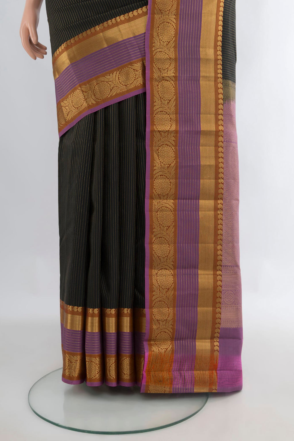 Pleats and pallu of Pure Silk Black Kanjivaram Saree with Stripes on the body and Zari Border. 
