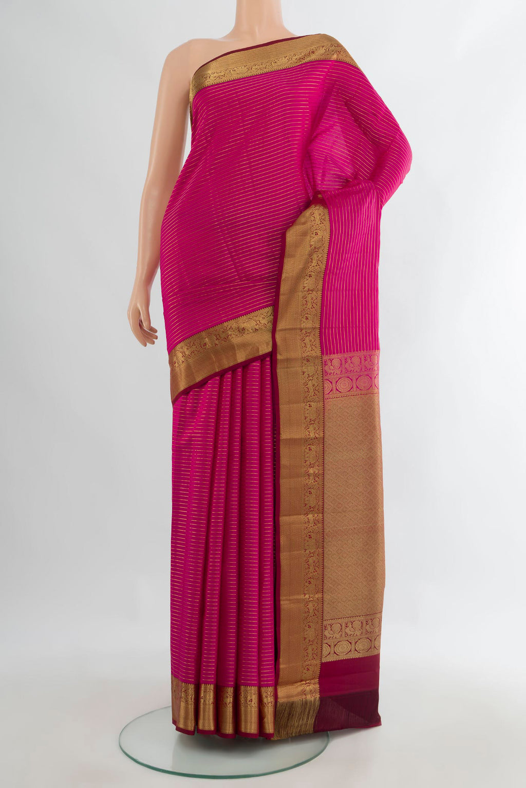 Pure Silk Dark Pink Kanjivaram Saree with Stripes on the body and Zari Border.  displayed on a mannequin