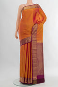 Mustard Kanjivaram Silk Saree with Stripes on the body and Zari Border.  displayed on a mannequin