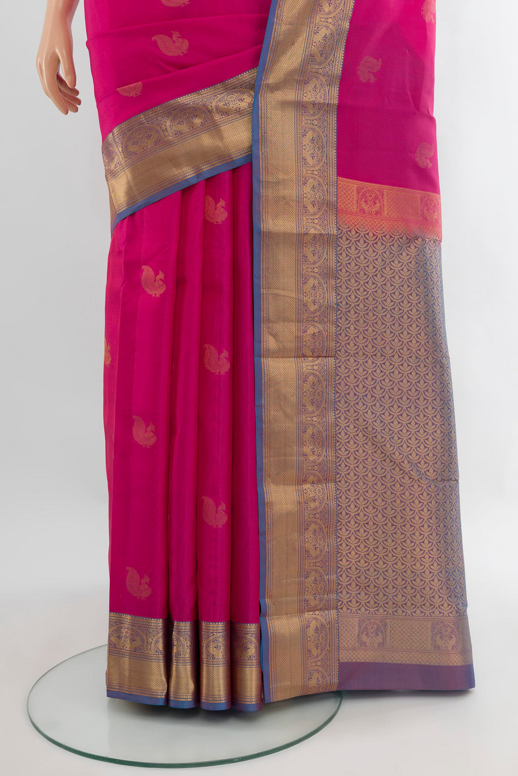 Pleats and pallu of Pink Kanchipuram Silk Saree with Zari Butta on the body and Zari Border. 