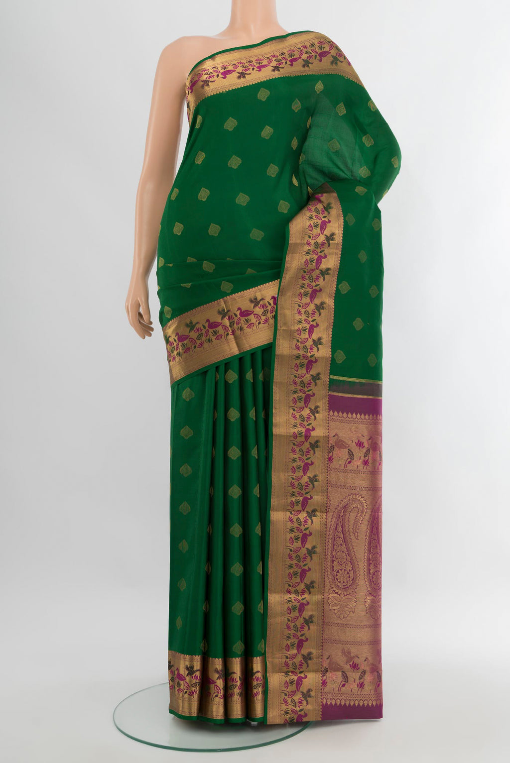 Bottle Green Kanjivaram Silk Saree with Zari Butta on the body and Zari Border.  displayed on a mannequin
