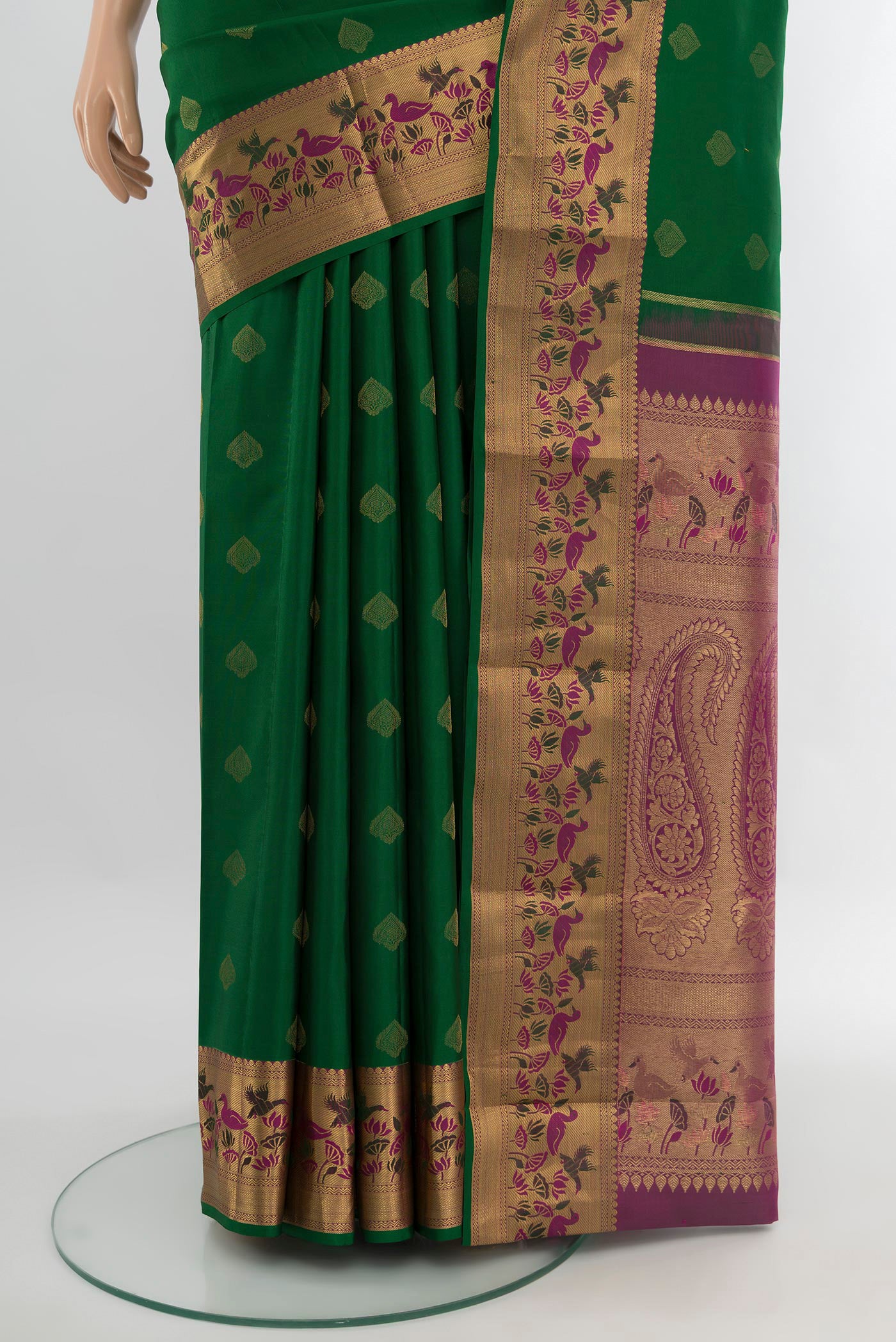 Pleats and pallu of Bottle Green Kanjivaram Silk Saree with Zari Butta on the body and Zari Border. 