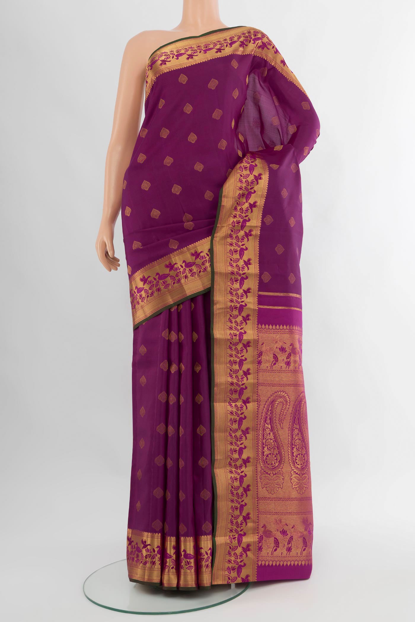 Purple Kanjivaram Silk Saree with Zari Butta on the body and Zari Border.  displayed on a mannequin