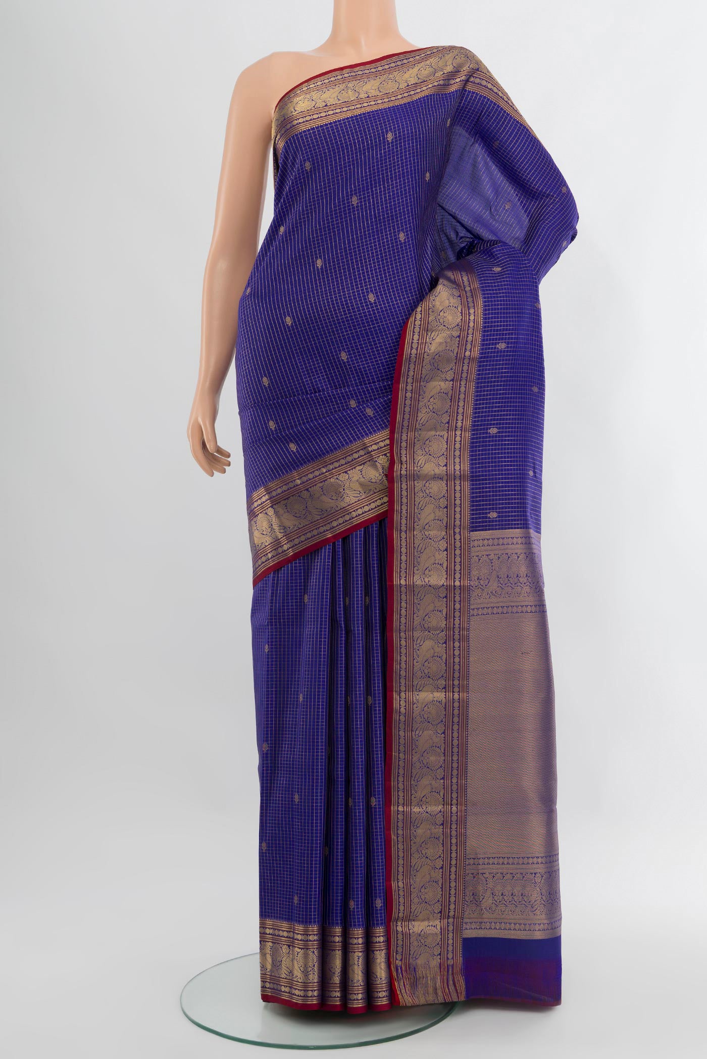 Royal Blue Kanchipuram Silk Saree with Checked design on the body and Zari Border.  displayed on a mannequin
