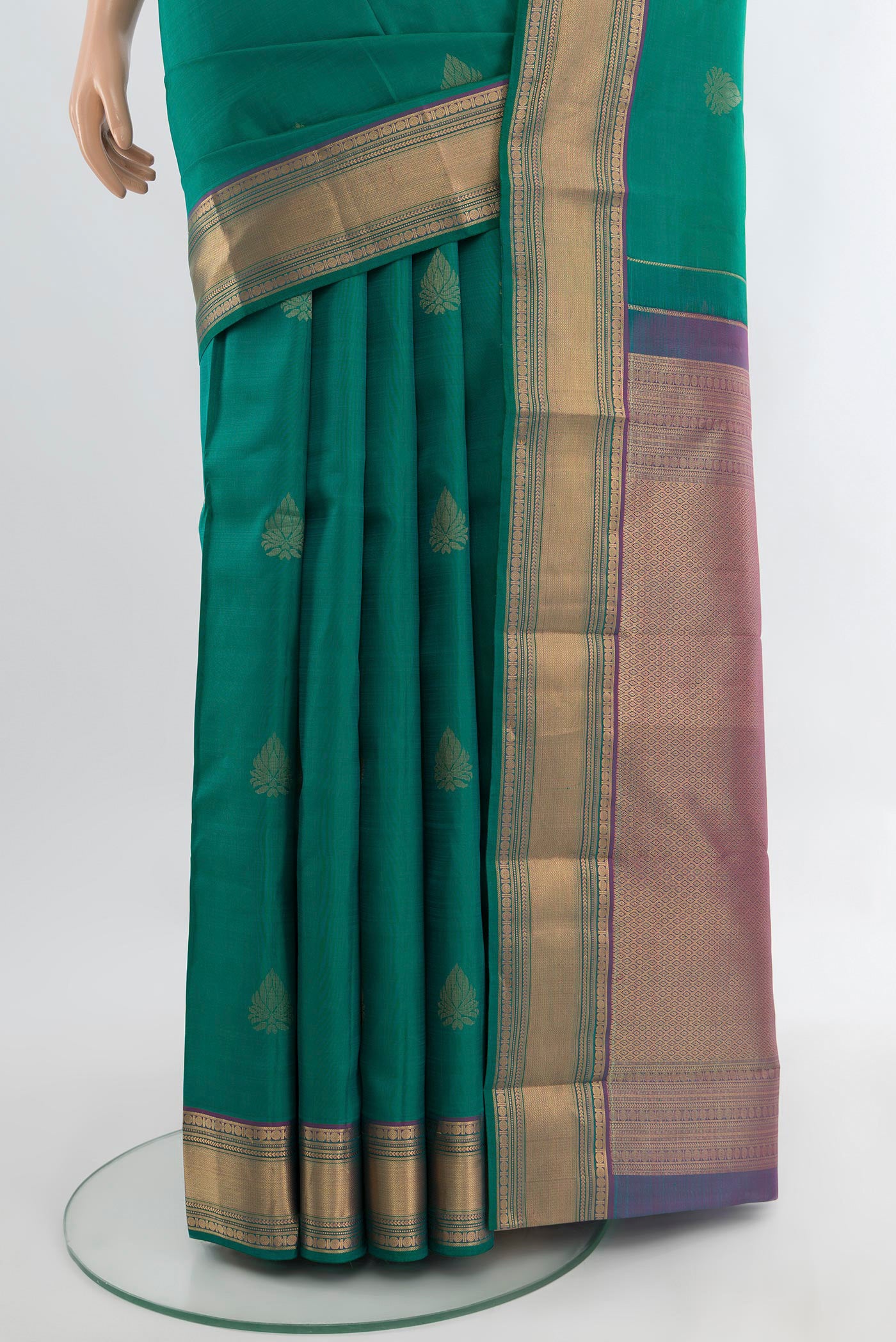 Pleats and pallu of Peacock Blue Kanchipuram Silk Saree with Zari Butta on the body and Silk Border. 