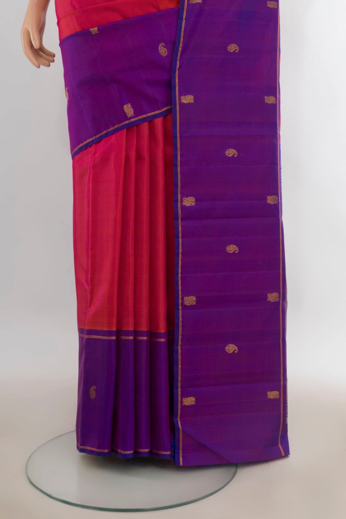 Pleats and pallu of Pure Silk Brick Orange Kanjivaram Saree with Plain Body and Zari Border. 