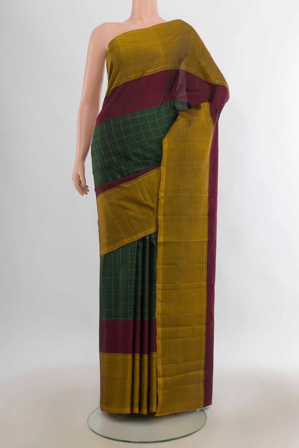 Pure Silk Bottle Green Kanchipuram Saree with Checked design on the body and Plain Border.  displayed on a mannequin