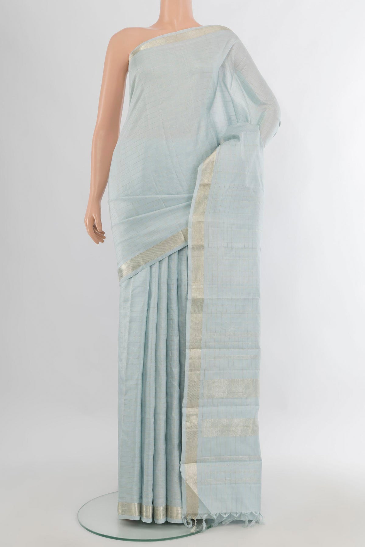 Pure Silk Light Blue Kanjivaram Saree with Stripes on the body and Zari Border.  displayed on a mannequin