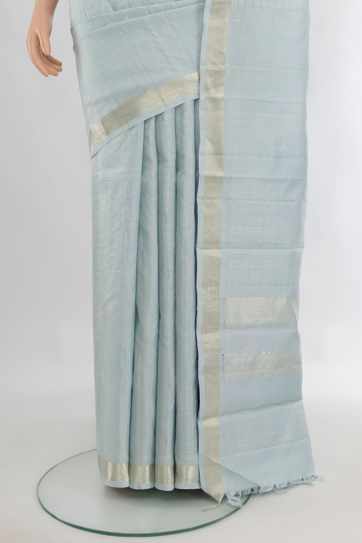 Pleats and pallu of Pure Silk Light Blue Kanjivaram Saree with Checked design on the body and Zari Border. 