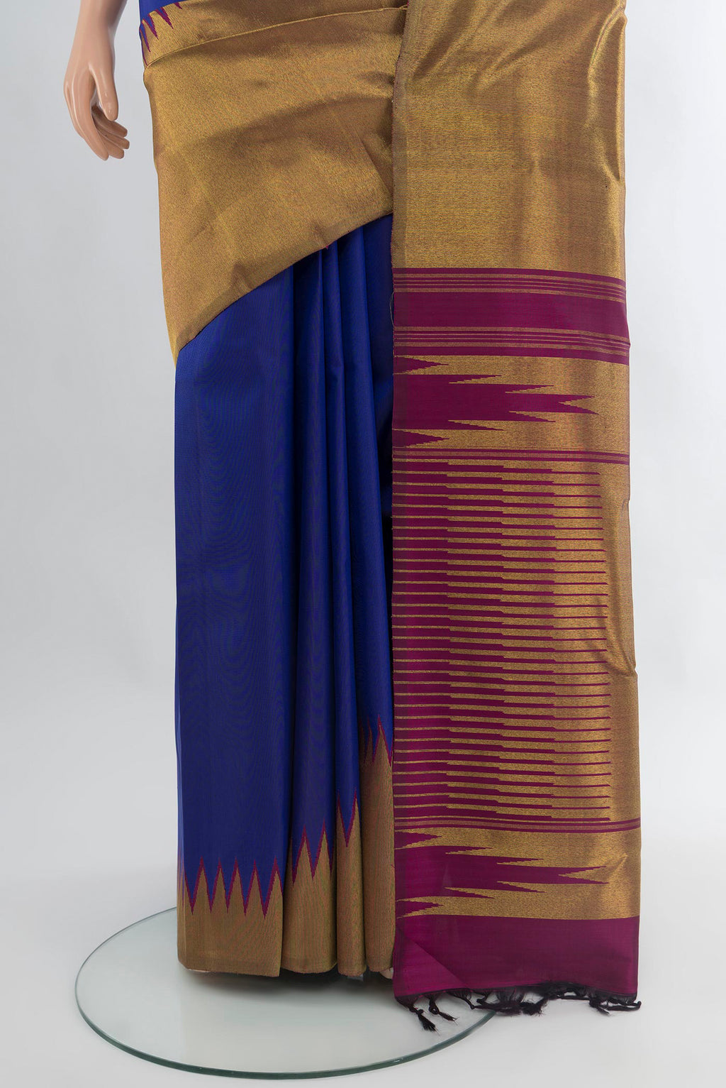 Pleats and pallu of Royal Blue Kanjivaram Silk Saree with Plain Body and Rising Temple Border. 