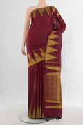 Pure Silk Maroon Kanjivaram Saree with Plain Body and Temple Border.  displayed on a mannequin