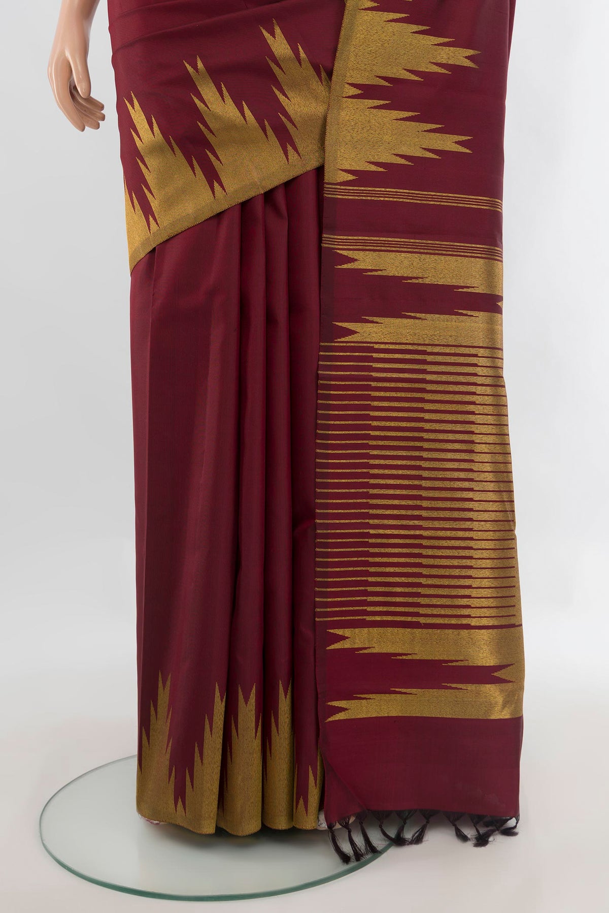 Pleats and pallu of Pure Silk Maroon Kanjivaram Saree with Plain Body and Temple Border. 