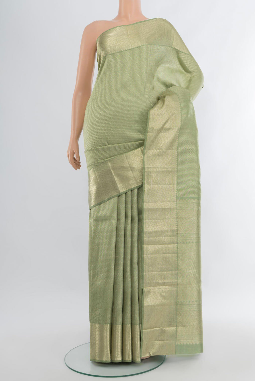 Sage Green Kanjivaram Silk Saree with Zari Brocade on the body and Zari Border.  displayed on a mannequin