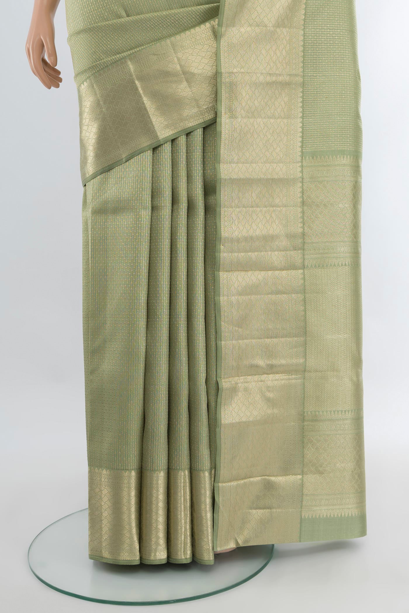 Pleats and pallu of Sage Green Kanjivaram Silk Saree with Zari Brocade on the body and Zari Border. 