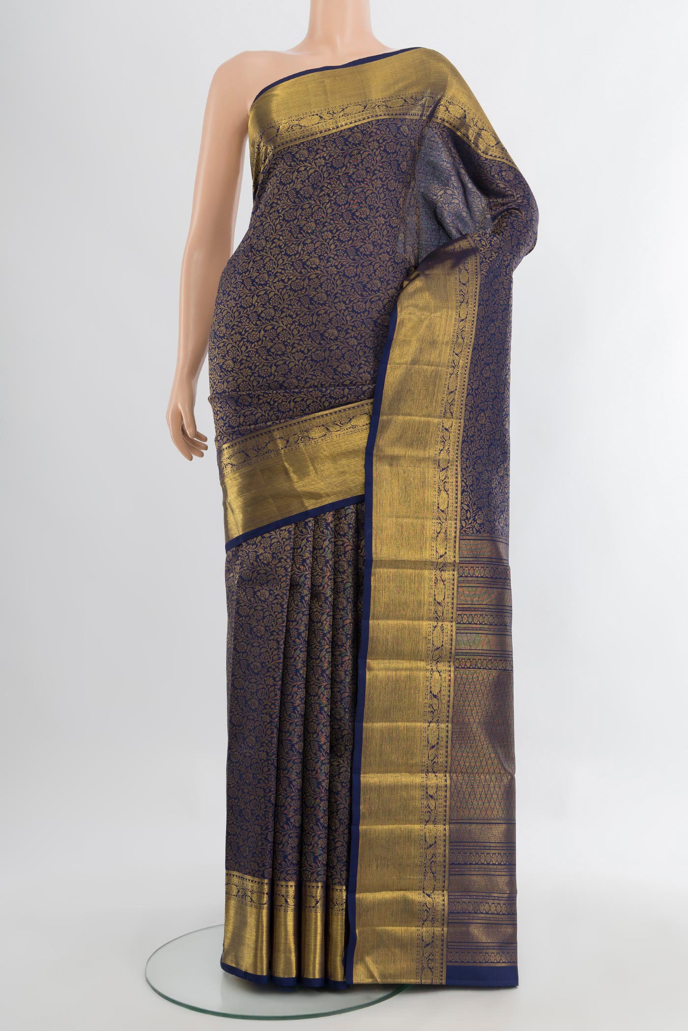 Pure Silk Pure Zari Navy Blue Kanjivaram Saree with Zari Butta on the body and Silk Border.  displayed on a mannequin