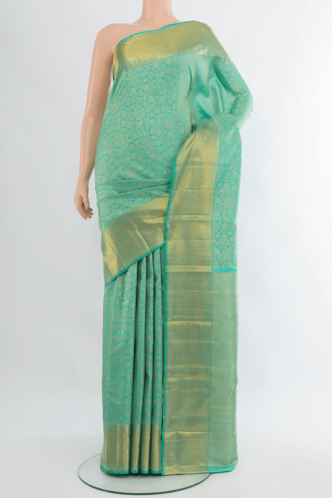 Turquoise Kanjivaram Silk Saree with Zari Brocade on the body and Zari Border.  displayed on a mannequin
