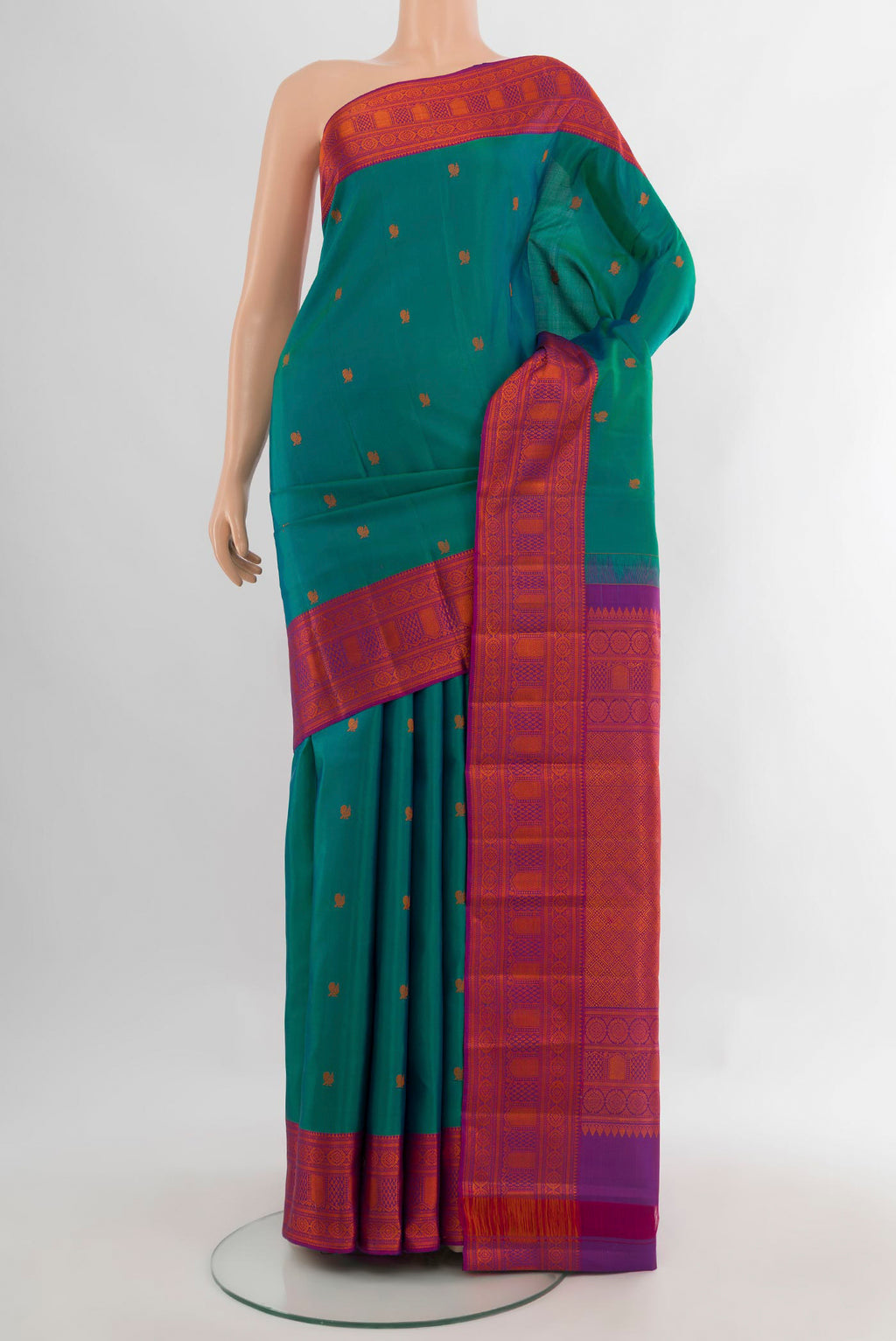 Pure Silk Turquoise Kanchipuram Saree with Thread Butta on the body and Thread Border.  displayed on a mannequin