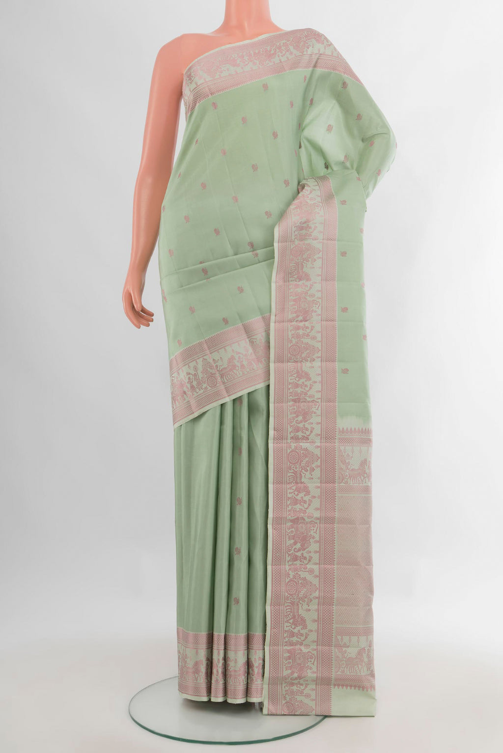 Pure Silk Pista Green Kanchipuram Saree with Thread Butta on the body and Thread Border.  displayed on a mannequin