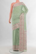 Pure Silk Pista Green Kanchipuram Saree with Thread Butta on the body and Thread Border.  displayed on a mannequin