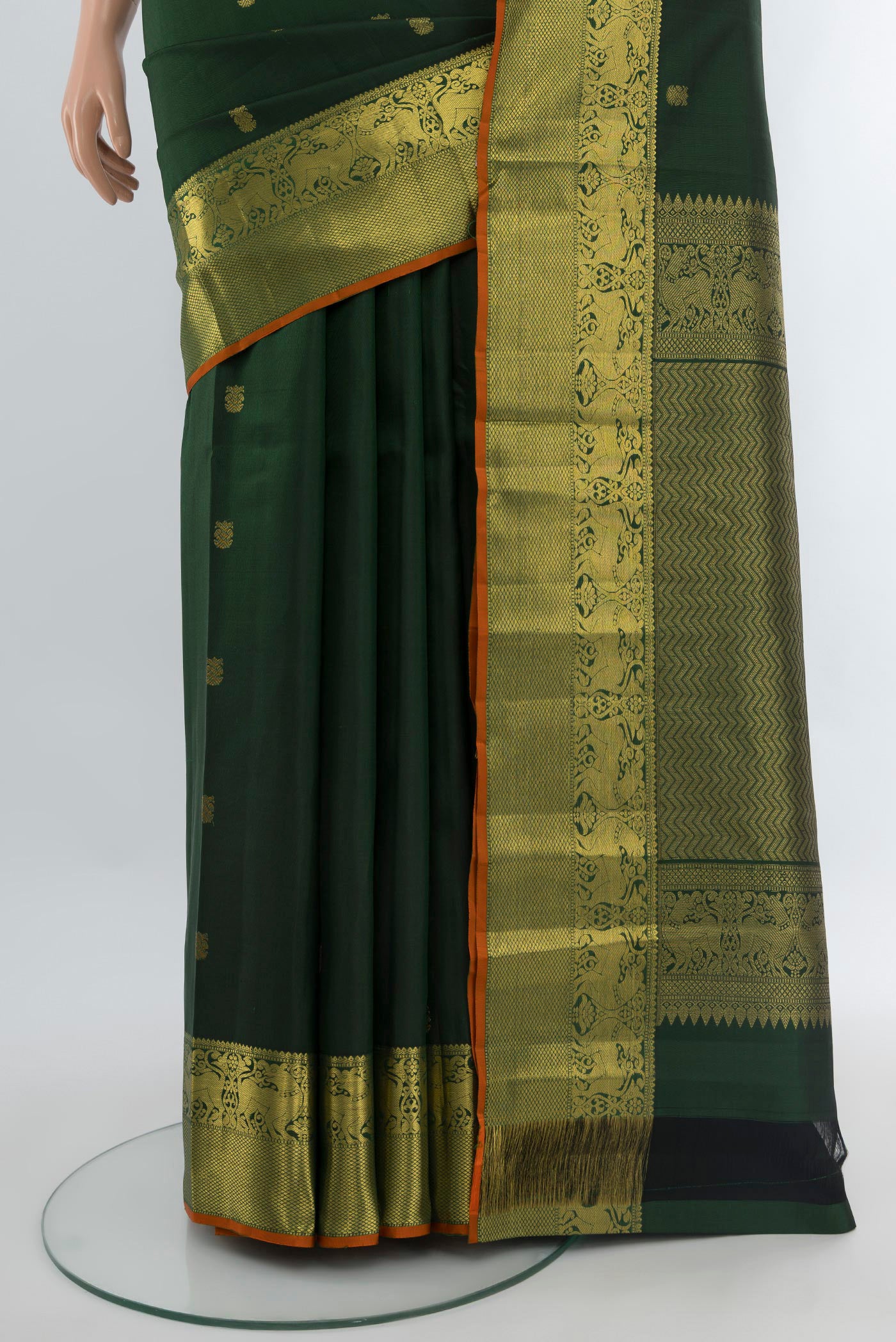 Pleats and pallu of Bottle Green Kanchipuram Silk Saree with Zari Butta on the body and Zari Border. 