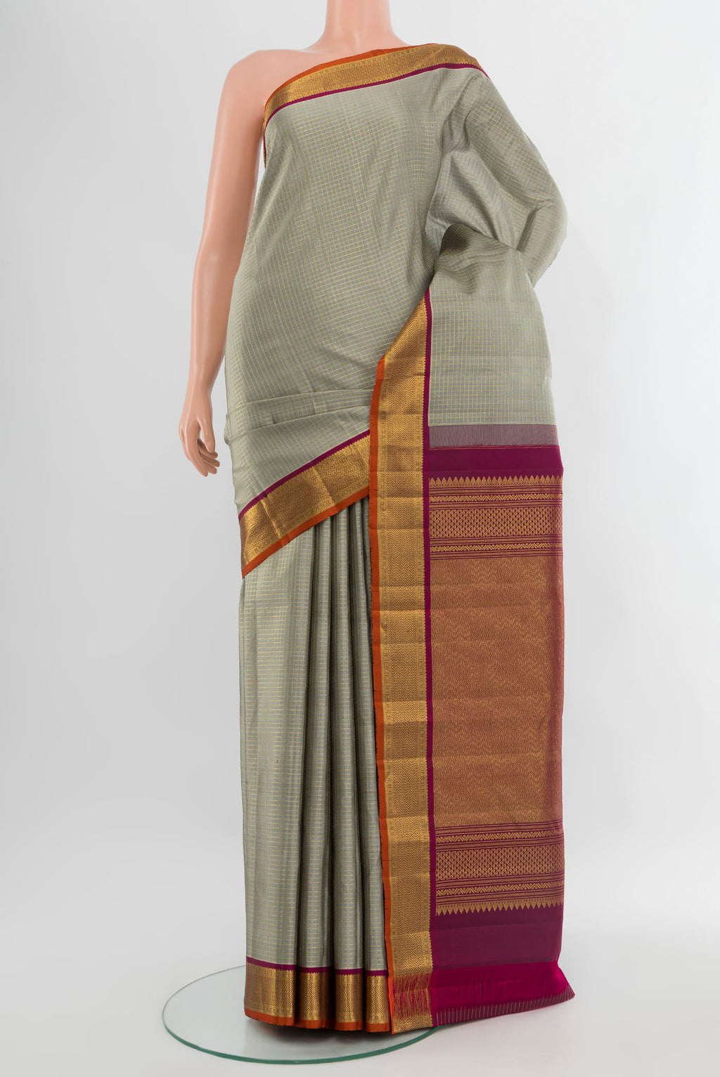 Davys Grey Kanjivaram Silk Saree with Checked design on the body and Zari Border.  displayed on a mannequin