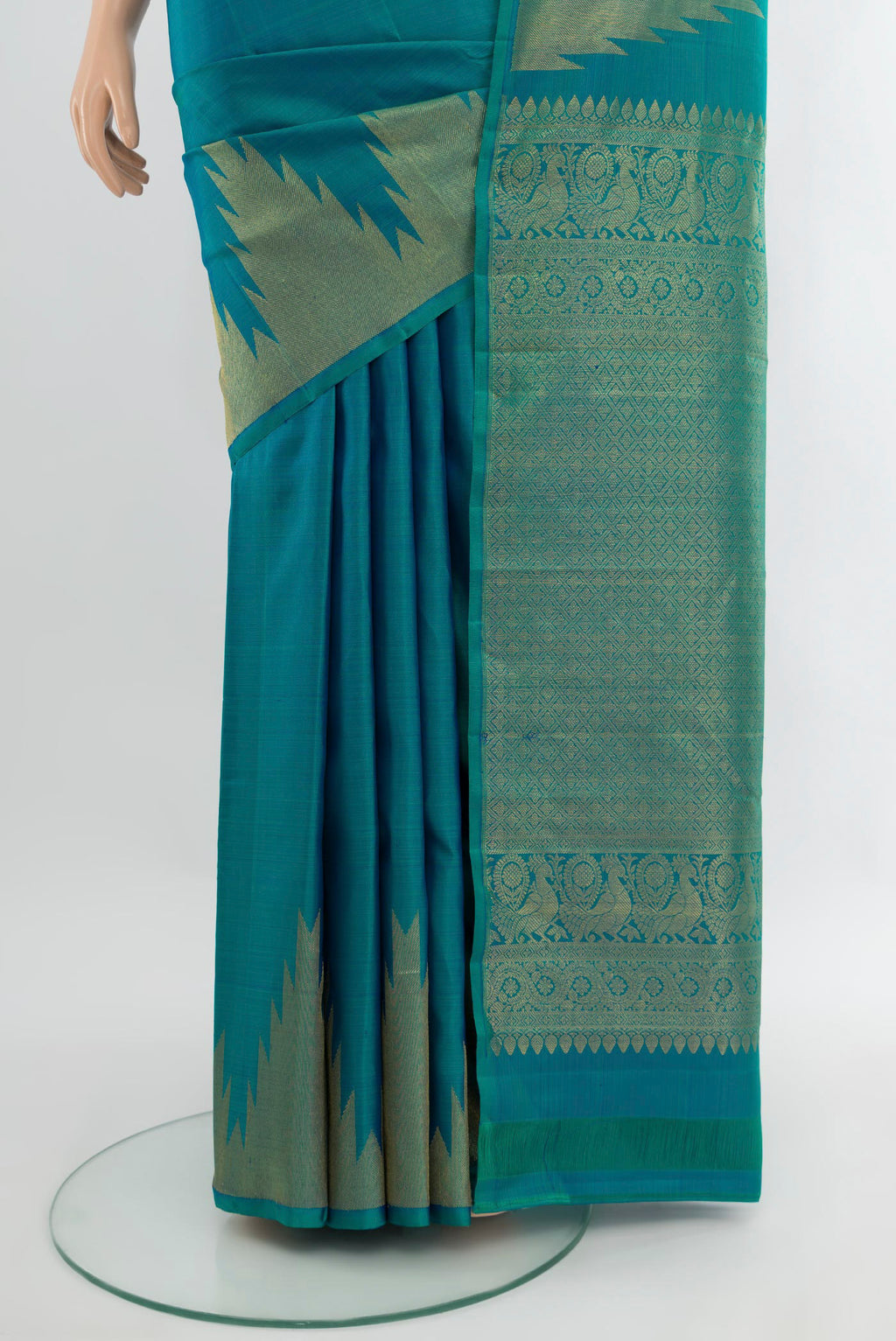 Pleats and pallu of Peacock Blue Kanjivaram Silk Saree with Plain Body and Temple Border. 
