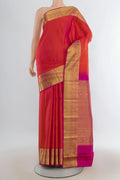 Pure Silk Orange Kanjivaram Saree with Checked design on the body and Zari Border.  displayed on a mannequin