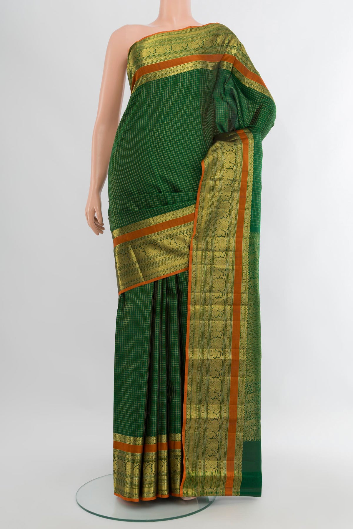 Bottle Green Kanjivaram Silk Saree with Checked design on the body and Zari Border.  displayed on a mannequin