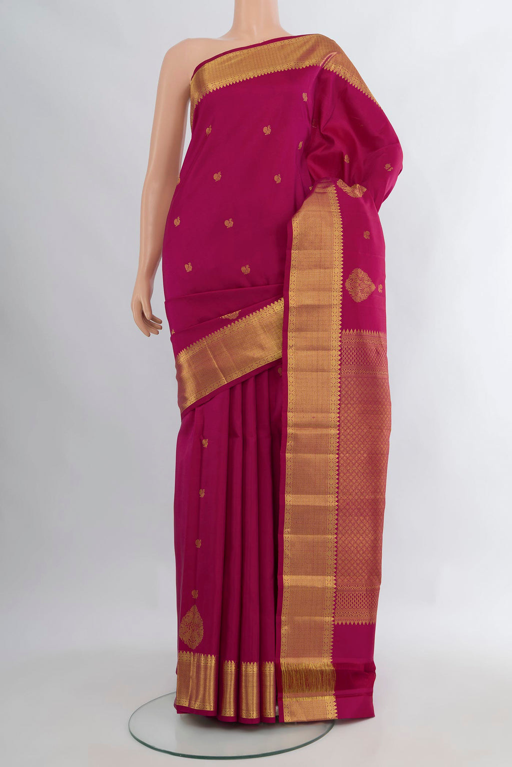 Pure Silk Magenta Kanjivaram Saree with Zari Butta on the body and Zari Border.  displayed on a mannequin