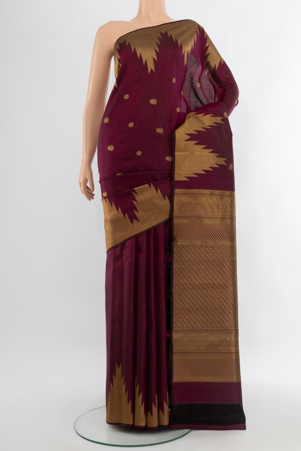 Purple Kanjivaram Silk Saree with Zari Butta on the body and Temple Border.  displayed on a mannequin