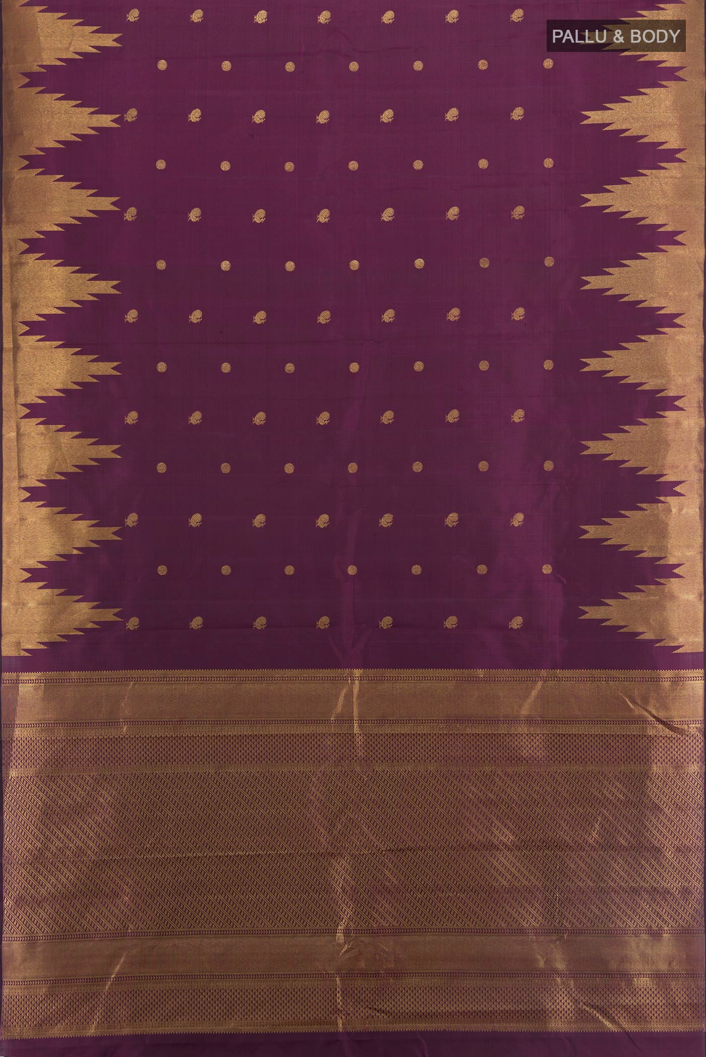 Flat view of Purple Kanjivaram Silk Saree with Zari Butta on the body and Temple Border. 