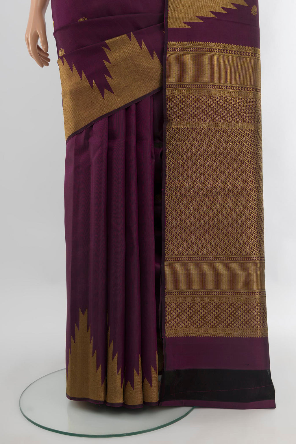 Pleats and pallu of Purple Kanjivaram Silk Saree with Zari Butta on the body and Temple Border. 