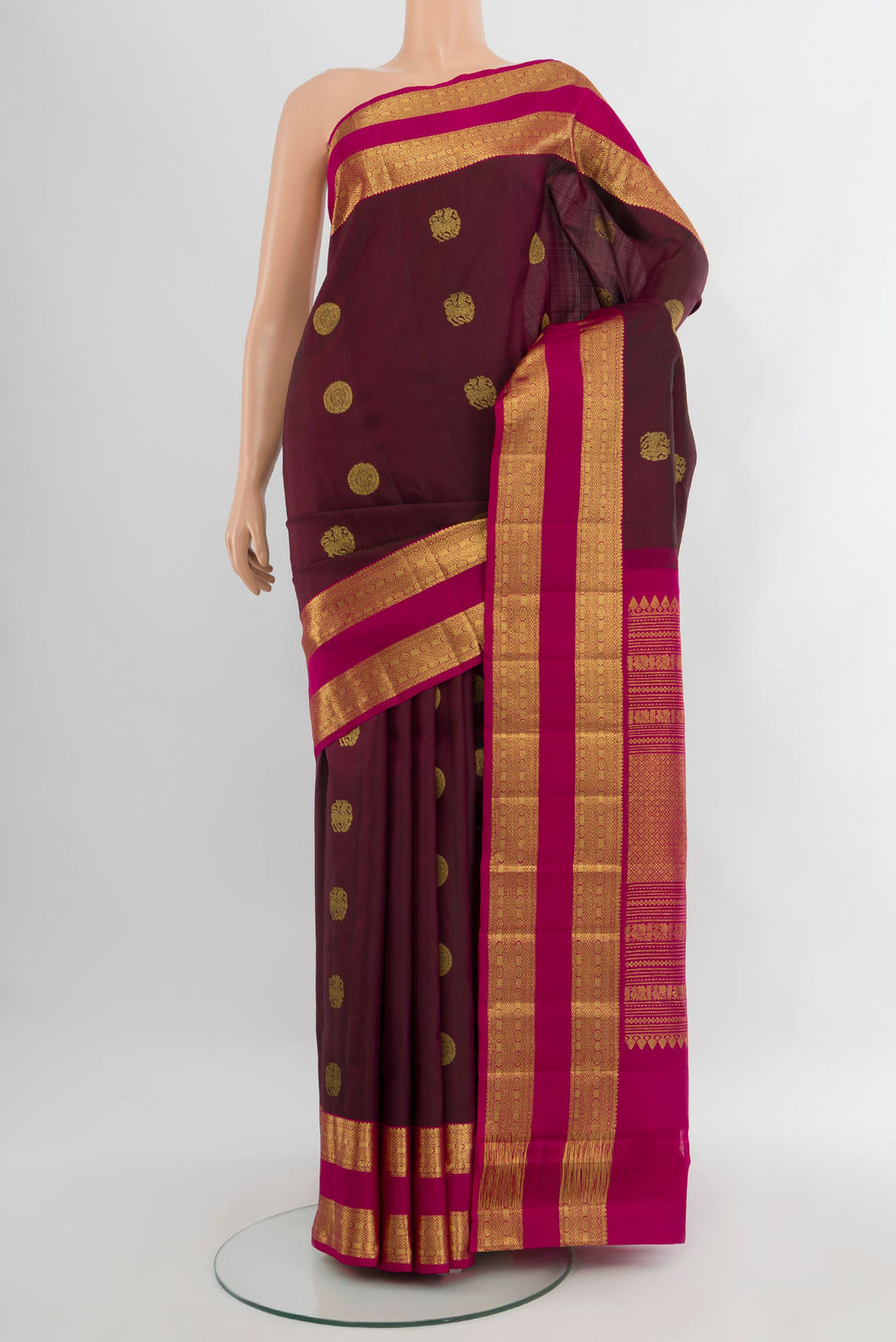 Coffee Brown Kanjivaram Silk Saree with Zari Butta on the body and Zari Border.  displayed on a mannequin