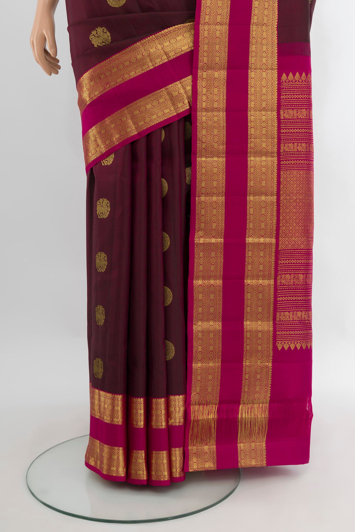 Pleats and pallu of Coffee Brown Kanjivaram Silk Saree with Zari Butta on the body and Zari Border. 