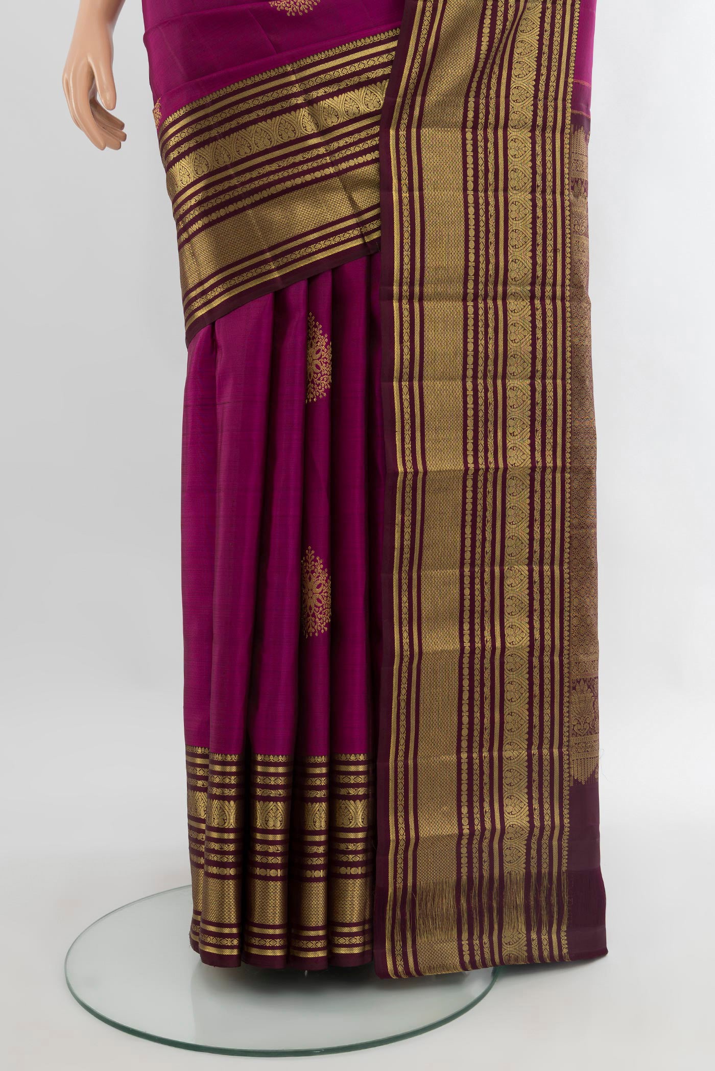 Pleats and pallu of Magenta Kanjivaram Silk Saree with Zari Butta on the body and Zari Border. 
