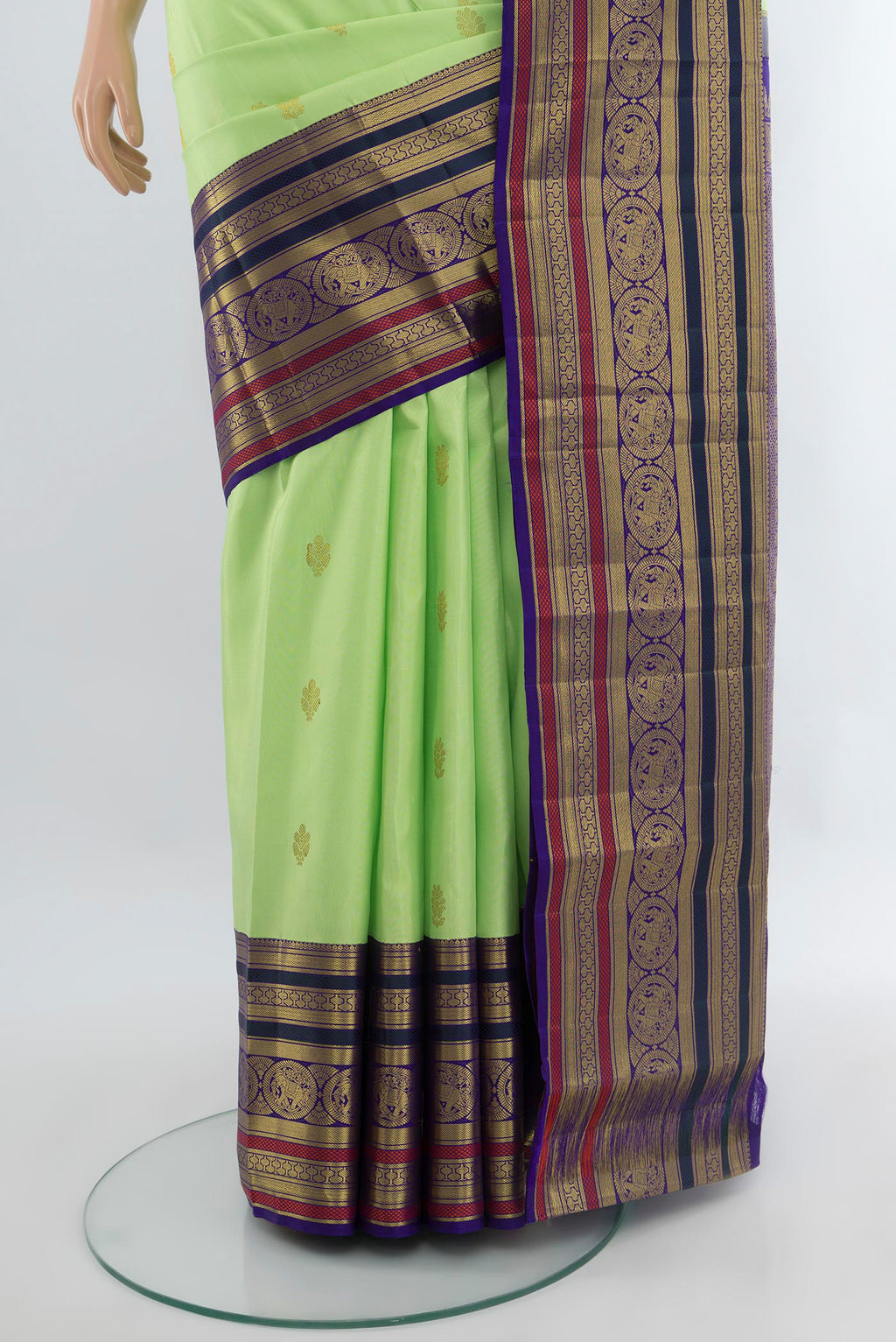 Pleats and pallu of Pista Green Kanjivaram Silk Saree with Zari Butta on the body and Zari Border. 